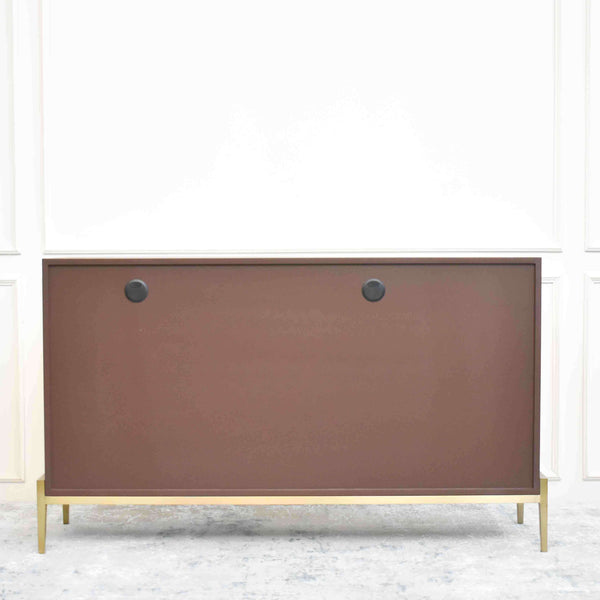 Back view of Harbour cabinet, with two grommet holes for cable management. 