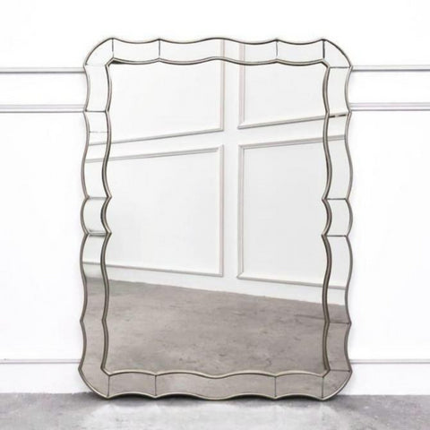 Hedvige Curved Wall Mirror, A beautiful piece of decorative mirror that 'wows' anyone who lays eyes on it. Intricate sides showcases its feminine side. Perfect as a dresser mirror or decorative wall mirror.