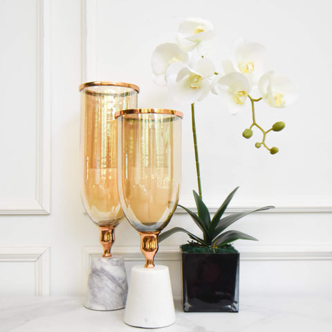 Tea-tinted glass cylindrical holders bring a touch of timeless elegance to your foyer decor or console table decor. 
