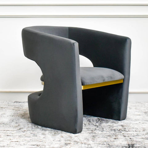 Inspired by Modern Luxury Design in a dark charcoal grey black tone, it introduces a whisper of indulgence to outstanding living interiors. A hint of shimmering gold lines the seat with an added luxe finishing touch.