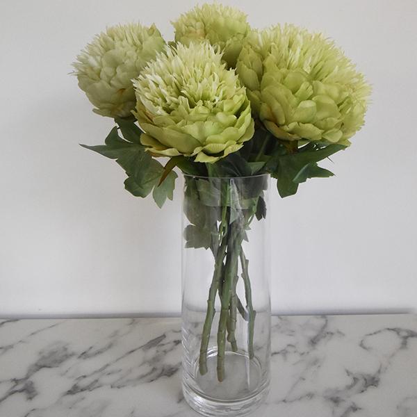 Faux Lime Green Peony bouquet of flower in the Cylindrical clear vase.