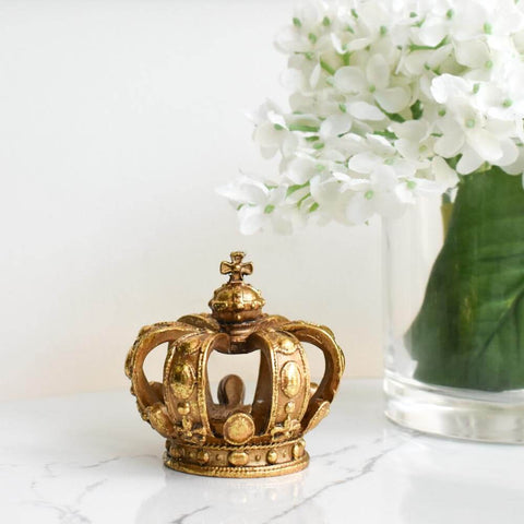 Luxe up easily by adding this decorative Crown Sculpture Decor to any table for a touch of glamour and fun. This rustic gold sculpture crown features a timeless home design that is needing a sparkle of gold. 