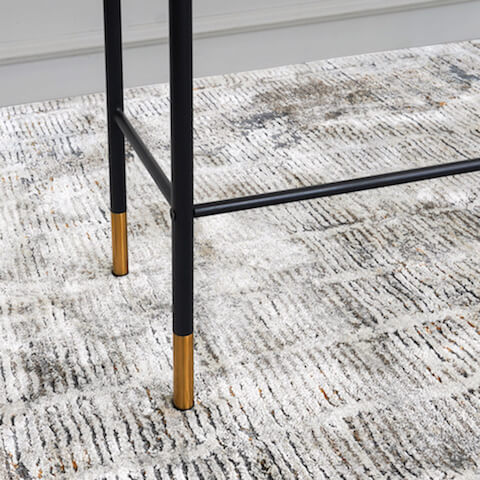 Black powder coated steel legs, with gold trims at the feet.