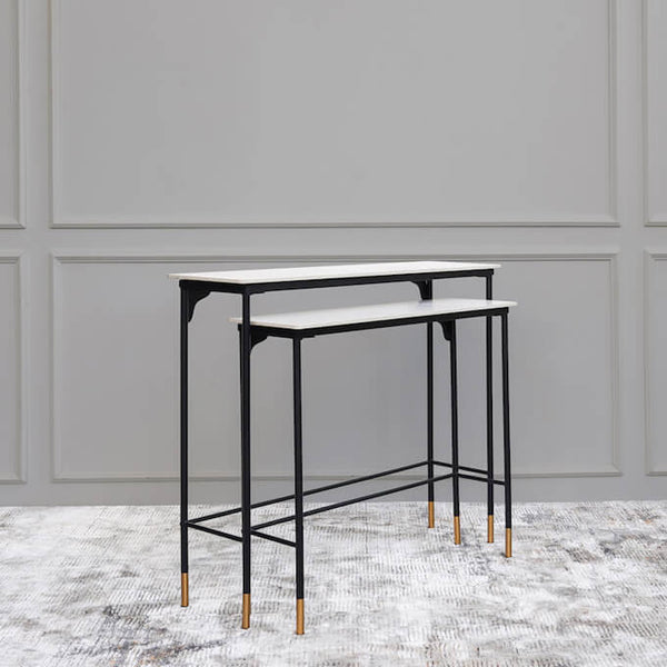 Cultured marble table top with black steel legs, gold tinted tips. 