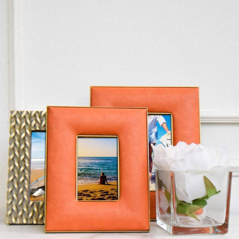 Maite Orange Leather Photo Frame in 2 Sizes displayed with White Flower in Small Square Vase  Decor.