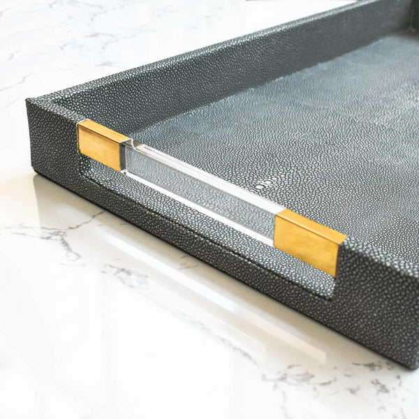 Close up look of the Merce tray, details of the Faux grey leather and acrylic handle.