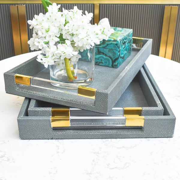 The Merce Tray Collection features unique style yet in coordinating sizes. Display together for a cohesive look or separately to create stylish harmony between rooms. 