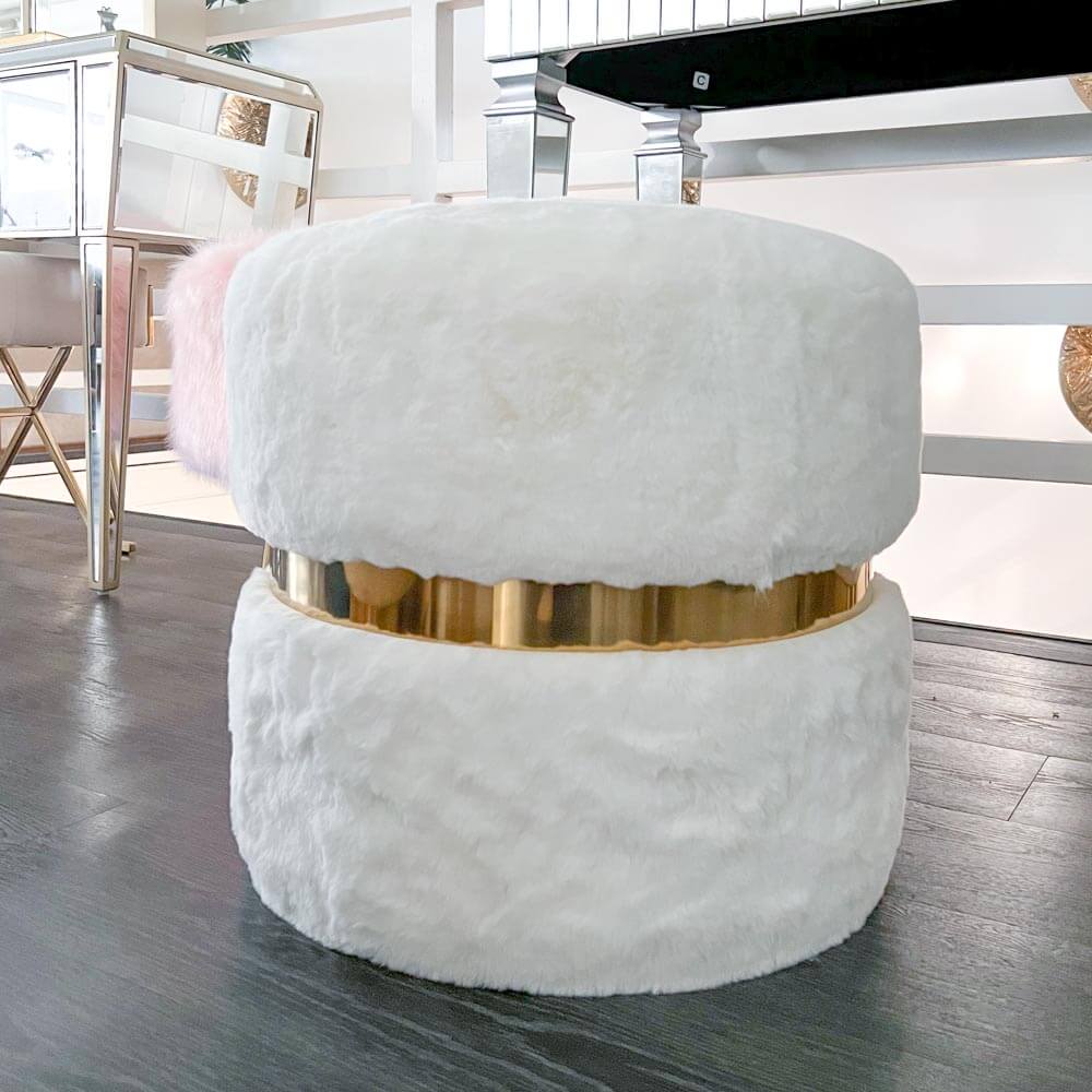 A classic timeless stool that magnifies innocence and beauty in white and stainless steel gold. An all-time round stool for a living room or entryway, or a vanity dressing stool that captures the center of attention each time.