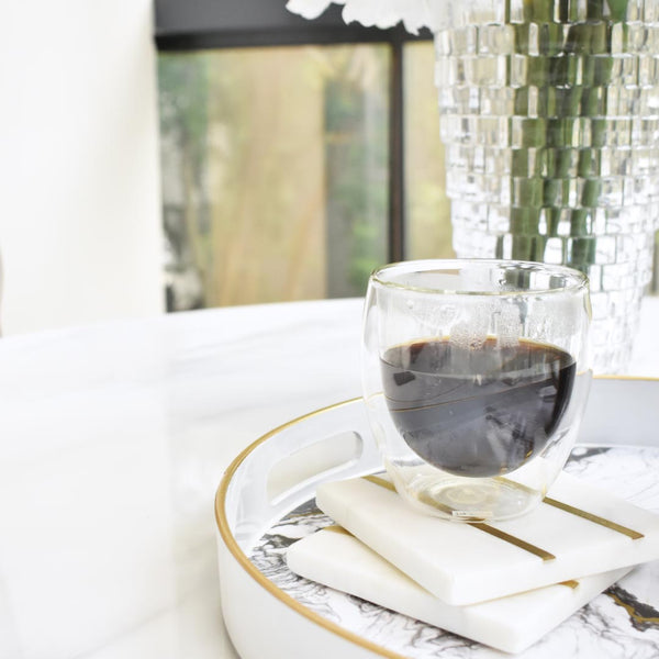 Minimalistic and modern, white and gold coasters to serve your guests in style.