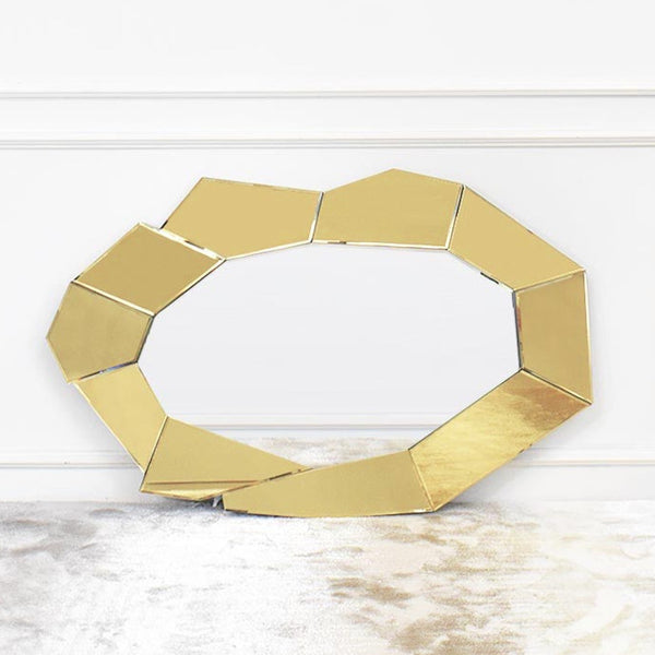 Horizontal view of Cartier mirror, gold glass mirror framing clear mirror.