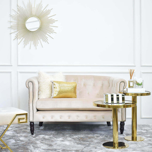 Modern Luxury Living Room Design Ideas with Sunburst Wall Art Displayed with White and Gold Decor Items at Furniture Store.