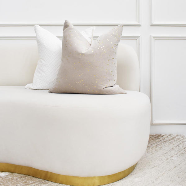 The Angel gold starlight cushion pairs well with the Zeta cushion on top of the Infiniti velvet sofa.