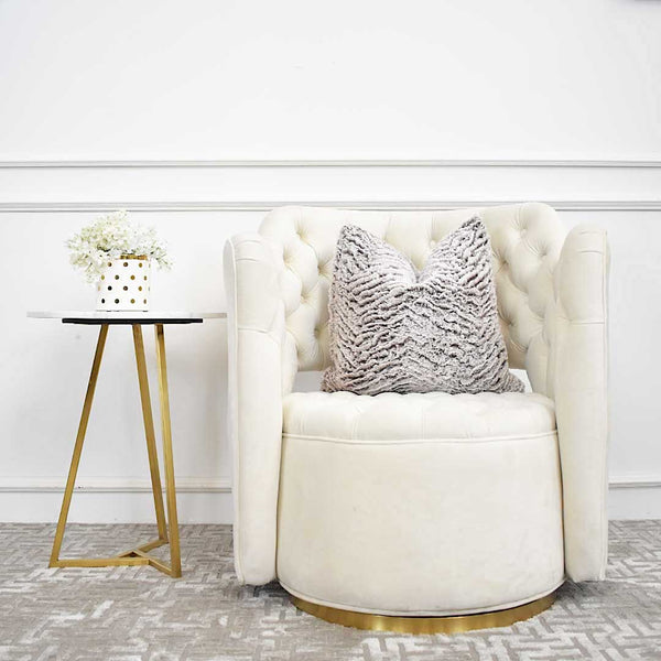 Match the Raphael swivel armchair with the Aleta side table for a mix of marble and gold details.