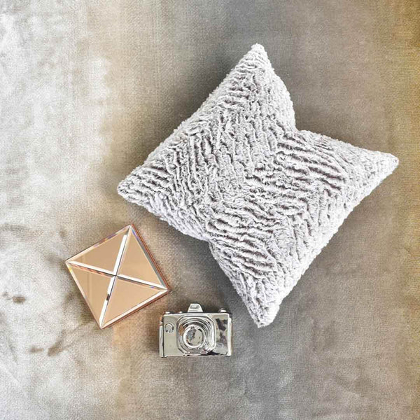 Top view of Montag Fur Throw Pillow, soft and puffy, fits perfectly on any modern sofa style.