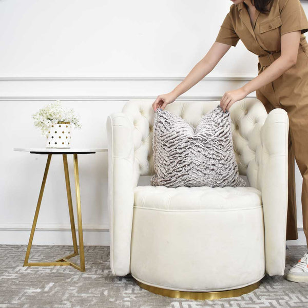 Style your Ivory armchair with a faux fur cushion for an added elegance and to soften the overall look of your luxurious living room.