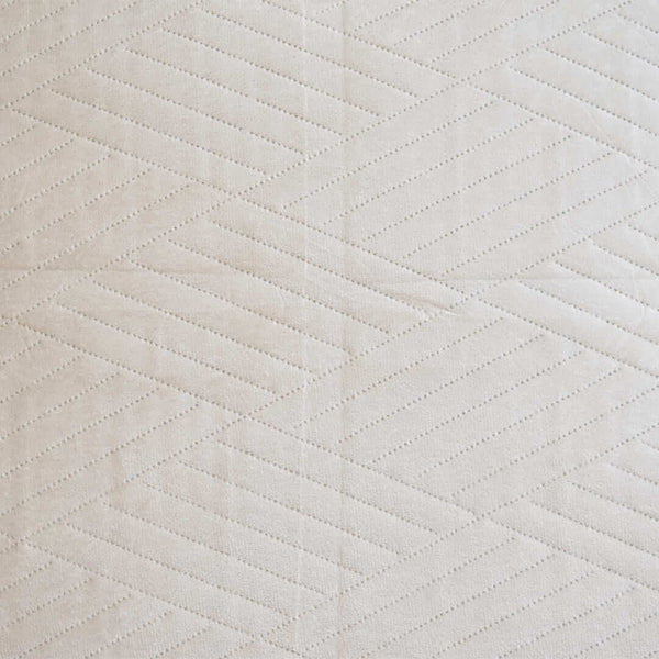 Zoomed in look of the embossed patterns and details on the Palais throw cushion.