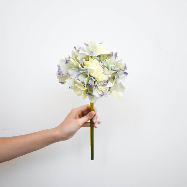 One stalk of Panicle Cream and Lavender Hydrangea faux flowers.
