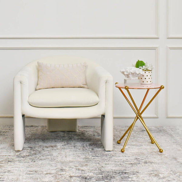 Atticus Beige boudoir cushion on Parc Velvet armchair with Amber Park gold marble end table.