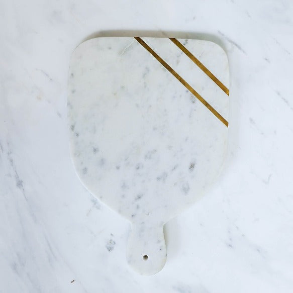 Brass striped inlay on the Paddle marble tray.