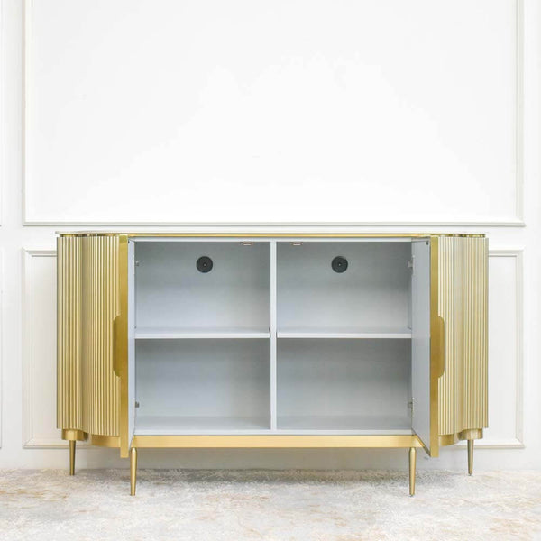 Spacious storage space, multiple shelving sections, with two grommet holes for cable management.