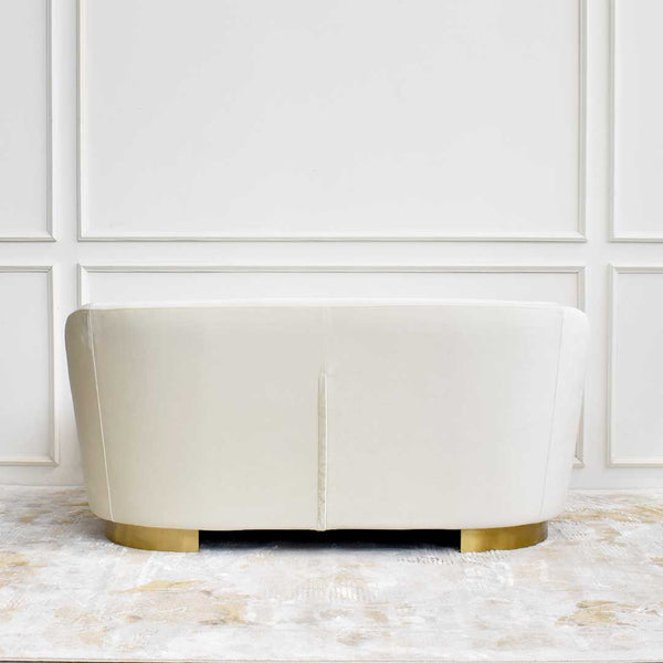 Back view of the Rever 2-Seater Sofa in smooth performance fabric, and elegantly curved leg frame.
