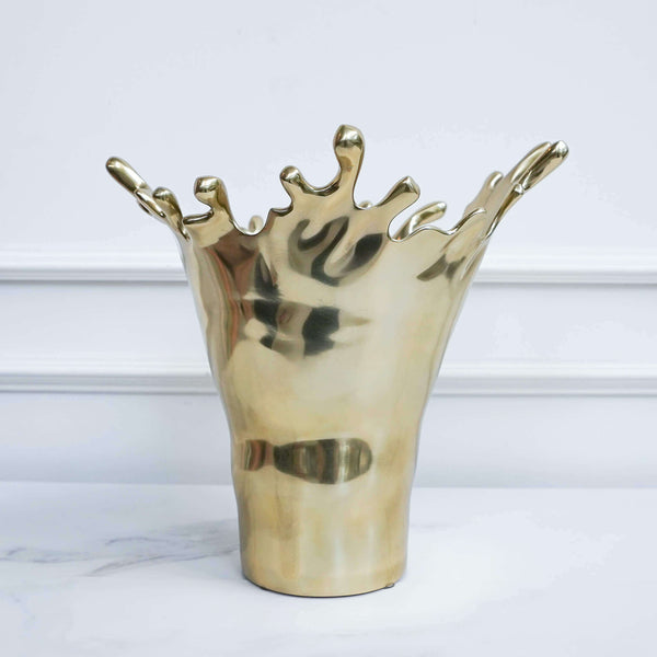 Gold vase with unique design great as home decor statement piece vase.