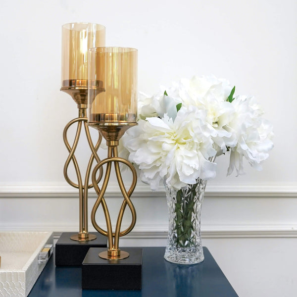 Pedestal Votive Holders on blue console table decor with white flower vase decor ideas.