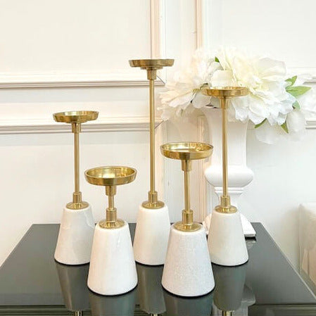 The gold color of this candle stick holders is stunning, vintage, extremely exquisite feel. They are slender, classic, heavy and with a good weight. 