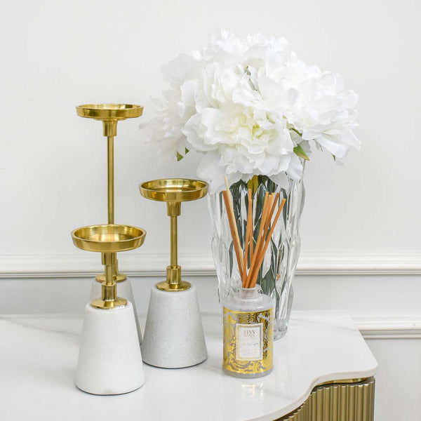 Tresor pillar candle holders, place them in varying heights in a group to give a sense of depth and height.