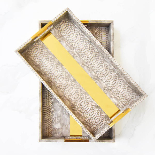 Polished gold band in the middle of the Tuscan faux leather tray stacked on top of each other.