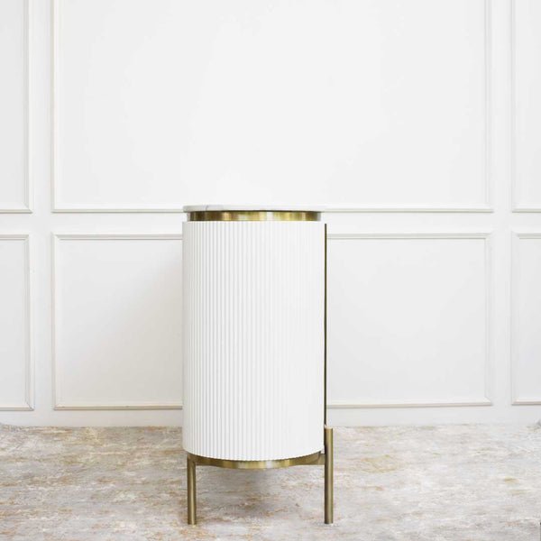 Slim side panels of the Verity cupboard, with champagne gold detailing.
