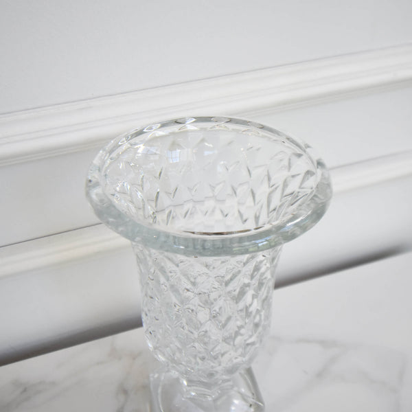 Close up look of the details of the Victoria glass vase. Decorative vase that holds up bouquets of flowers or as a decor piece.