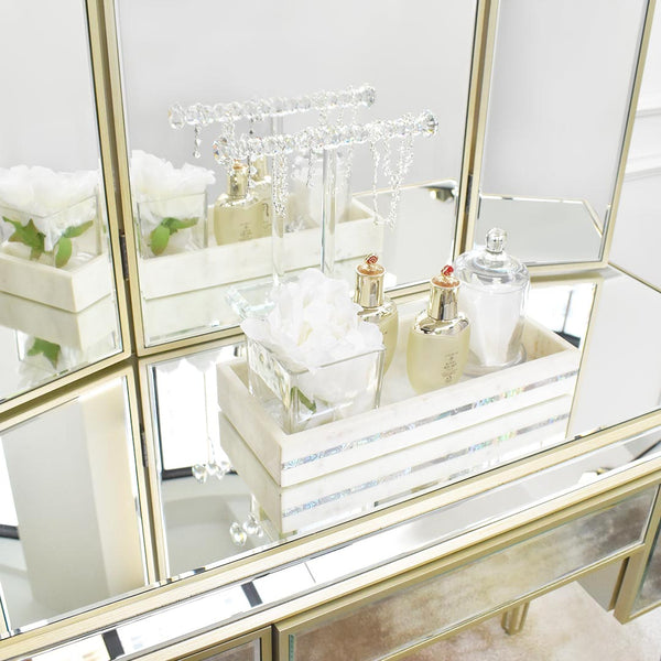 Zoomed in look of the mirrored Marcie dressing table, hand painted vintage champagne gold details.