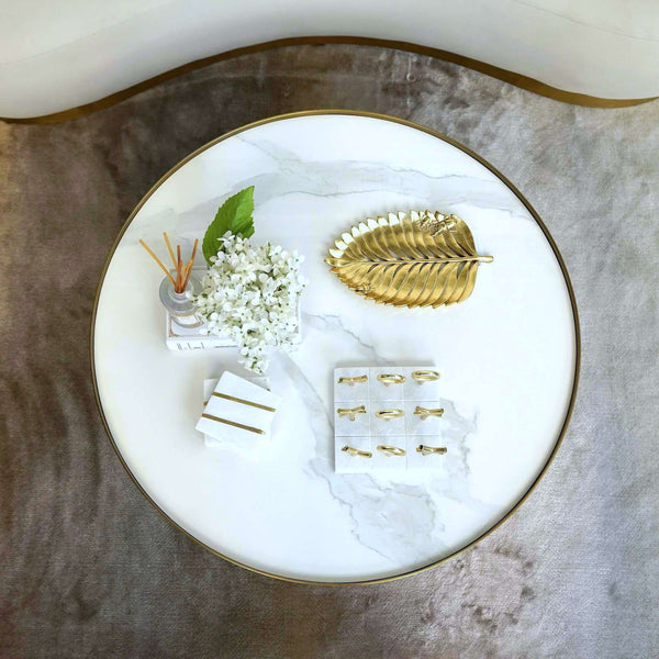 White Marble Coffee Table Decor Display with Gold Leaf Tray and Decor from Finn Avenue Furniture Showroom.